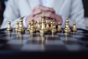 Business competition concept with table chess game photo