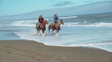 Super slow motion shot of women riding horses at beach, Oregon, shot on Phantom Flex 4K video
