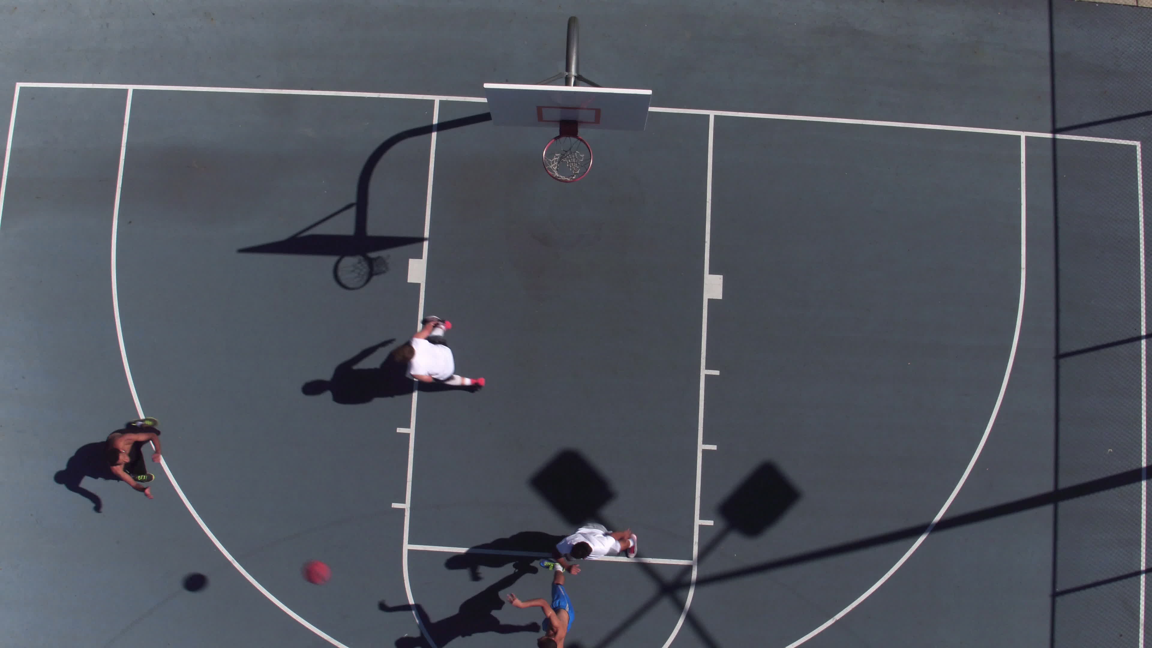 Friends playing basketball at park, overhead shot 2570169 Stock Video