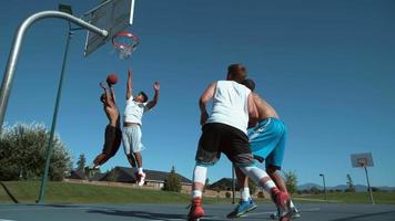 Super slow motion shot of friends playing basketball, shot on Phantom Flex 4K video