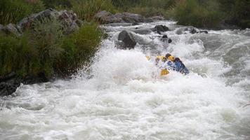 Super slow motion shot of group of people white water rafting, shot on Phantom Flex 4K video