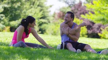Athletic couple at park stretching before run video