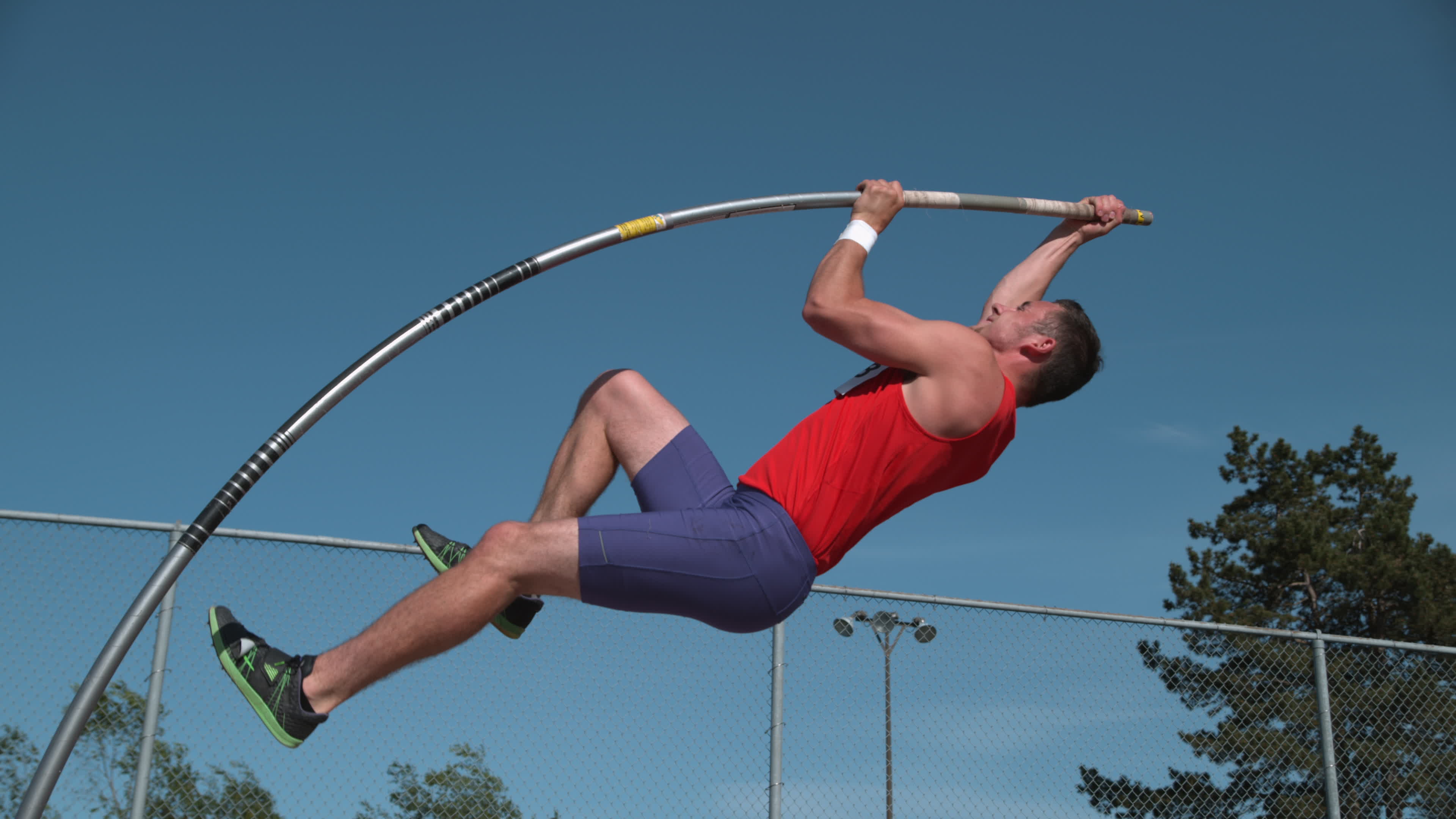 Track athlete doing pole vault in super slow motion, shot on Phantom Flex 4K 2570573 Stock Video