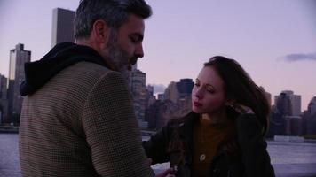 Couple in New York City with city skyline in background video