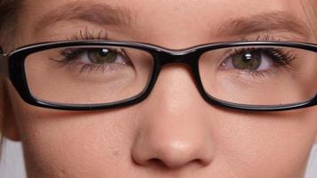 Extreme closeup of young woman with glasses video