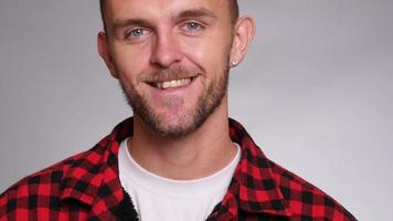 Closeup portrait of man on white background video