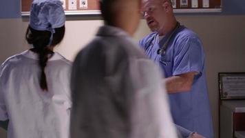 Emergency room doctors examine man with head injury