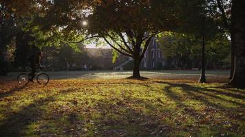 College student on campus riding bicycle video