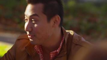 Closeup of college student on campus talking to classmates video