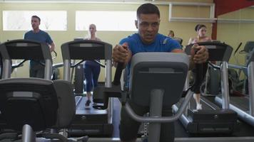 Man working out hard on stair machine at gym video