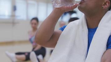 Man at gym takes a break video