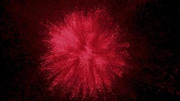 Red powder exploding on black background in super slow motion, shot with Phantom Flex 4K video