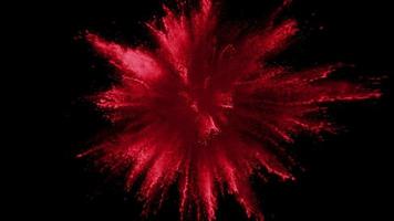 polvere rossa che esplode su sfondo nero in super slow motion, ripresa con phantom flex 4k video