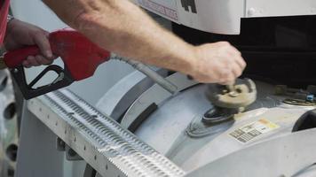 Closeup shot of truck driver filling up fuel tank.  Fully released for commercial use. video