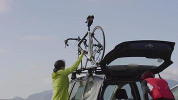 Cyclists preparing bicycle for ride.  Fully released for commercial use. video