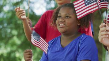 Kids waving flags on Fourth of July video
