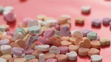 Valentine's Day heart shaped candy falling and bouncing in slow motion. Shot on Phantom Flex 4K. video