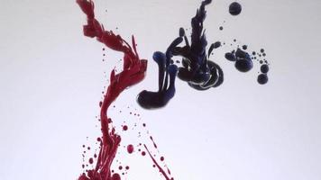 Slow motion shot of ink pouring into oil, shot with Phantom Flex 4K camera. video