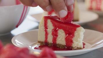 Garnishing cheesecake with raspberry and mint leaf video