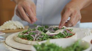 Adding toppings to pizza video