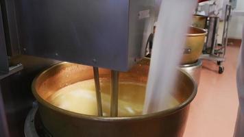 Mixing ingredients for chocolate fudge at candy factory