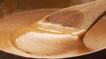 Stirring melted caramel, closeup food shot. video