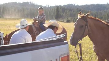 Cowboys take break from herding cattle video