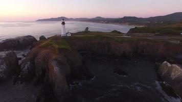 Aerial view of Yaquina Bay Lighthouse at sunset, Newport, Oregon video