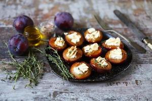 Baked plums with feta cheese photo