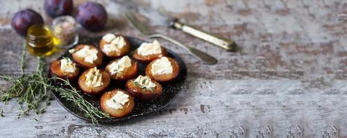 Baked plums with feta cheese photo