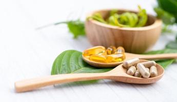 Alternative medicine herbal organic capsule with vitamin E omega 3 fish oil photo