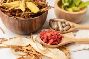 Chinese herb medicine with goji berries for good healthy photo