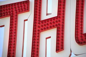 Big bright letters on a sign at a carnival in the summer photo