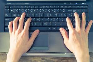 Hand caucasian man put on notebook typing photo