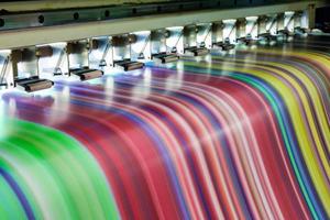 Large inkjet printer working multicolor on vinyl banner photo