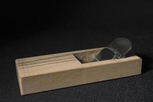 Japanese hand plane on a black background photo