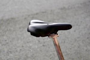 black bicycle seat on the street photo