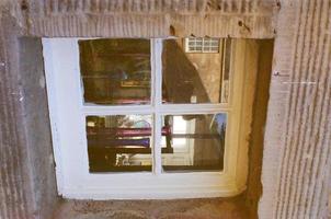 Old window on a brick building photo