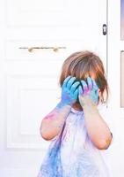 Little girl dirty of paint photo