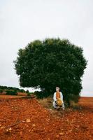 Middle age woman alone in nature in a cold autumn day photo