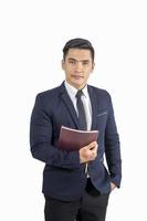 Handsome businessman holding book isolate on white background photo