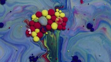 Abstract close up texture of oil with blue, red and yellow paint video