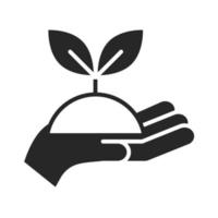 donación caridad voluntario ayuda social mano sosteniendo planta silueta estilo icono vector
