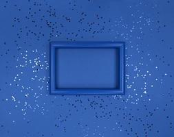 Frame and confetti stars on navy background. photo