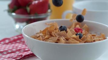 Blueberries and raspberries falling into cereal in slow motion shot on Phantom Flex 4K at 1000 fps