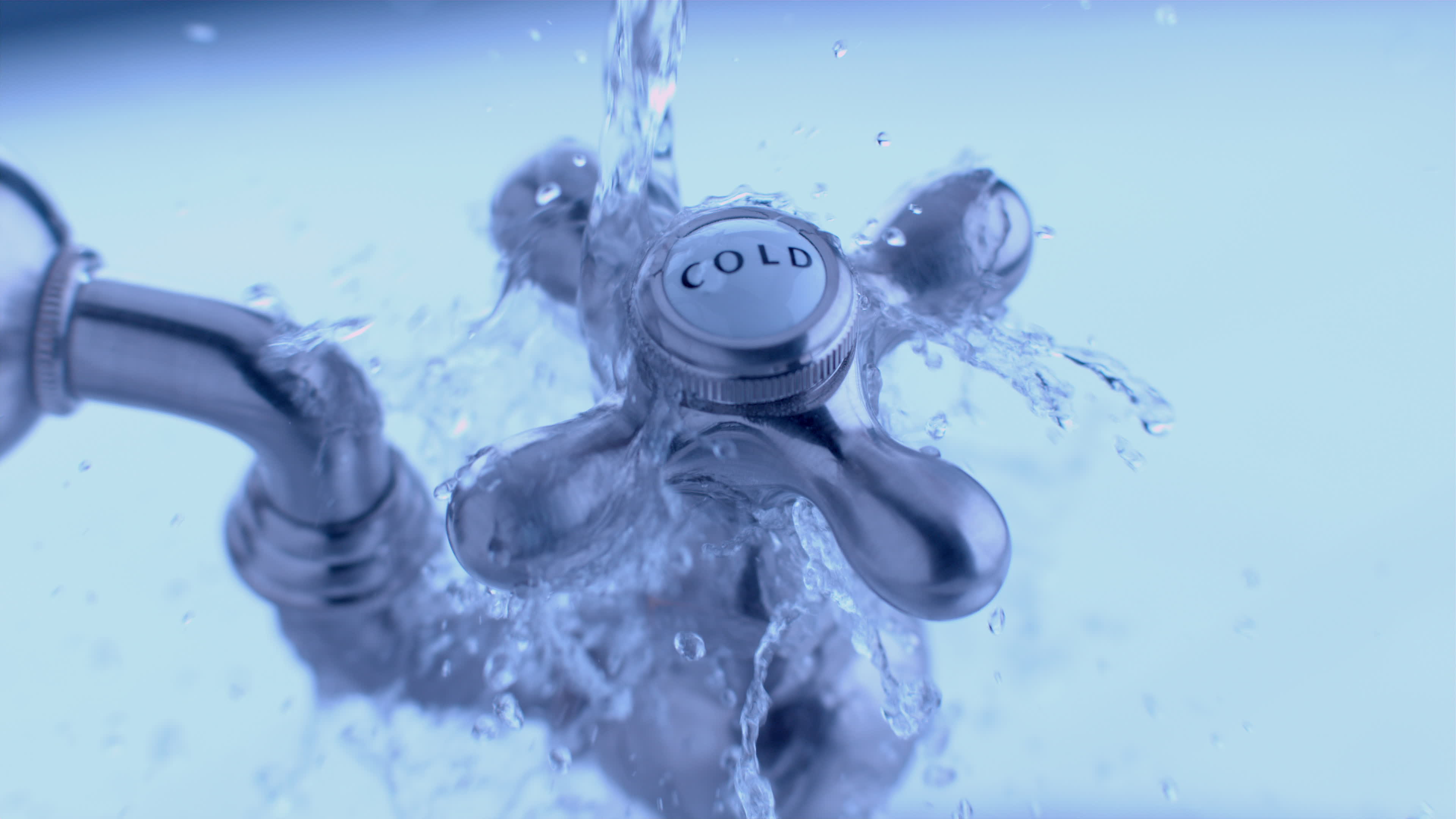 Cold water tap with water splashing in slow motion shot on Phantom Flex