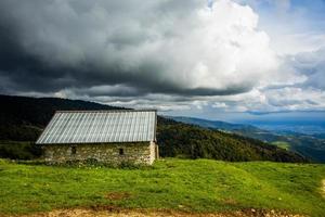 Hut and stormy sky