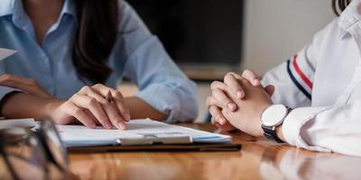 Close up of businesspeople meeting to discuss the situation in the market, business financial concept photo