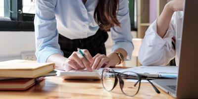 Close up of businesspeople meeting to discuss the situation in the market. Business financial concept photo