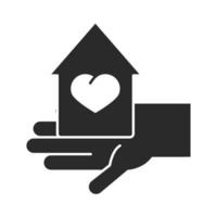 mano sostiene la casa amor caridad donación silueta icono vector